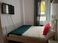 A bed or beds in a room at Acogedoras Habitaciónes en Madrid