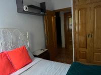 A bed or beds in a room at Acogedoras Habitaciónes en Madrid