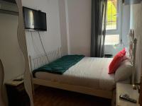 A bed or beds in a room at Acogedoras Habitaciónes en Madrid