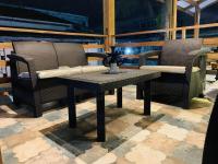 a table and two chairs on a patio at Namaste hotel & restaurant in Libreville