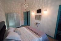 Posteľ alebo postele v izbe v ubytovaní Hotel Hostal Chic