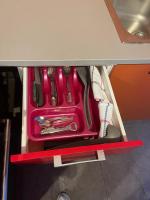 a drawer with a pink tool organizer in a cabinet at CASA COLIVING avec chambre salle de bain individuelles privatives in Saint-Pierre