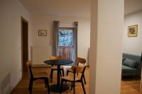 a dining room with a table and chairs in a room at Gasthof Faust in Vols am Schlern