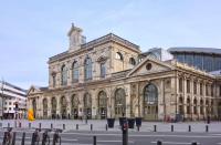 a large building with a clock tower on top of it at Vieux Lille appartement 1 chambre in Lille