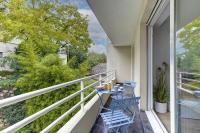 a balcony with two chairs and a table on it at 322 Suite Fes - Superb apartment in Suresnes