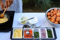 a table with a tray of food and a bowl of eggs at Hotel Dolmaling in Kathmandu