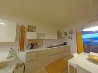 A kitchen or kitchenette at Comodo appartamento Casa Razzoli