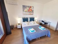 A bed or beds in a room at Comodo appartamento Casa Razzoli