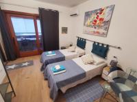 A bed or beds in a room at Comodo appartamento Casa Razzoli