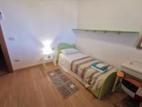 A bed or beds in a room at Comodo appartamento Casa Razzoli