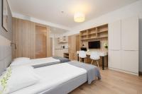 Postel nebo postele na pokoji v ubytování Business Studio Apartments Wolska by Noclegi Renters