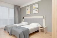 Postel nebo postele na pokoji v ubytování Business Studio Apartments Wolska by Noclegi Renters