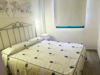 Postel nebo postele na pokoji v ubytování LIFE APARTMENTS EL PORTIL