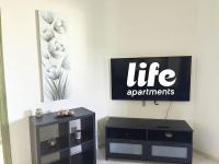 TV a/nebo společenská místnost v ubytování LIFE APARTMENTS EL PORTIL