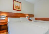 Postel nebo postele na pokoji v ubytování Hotel Palacios