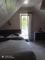 Posteľ alebo postele v izbe v ubytovaní Całoroczny Ośrodek Wypoczynkowy COMFORT HOUSE