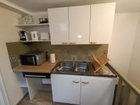Kuchyňa alebo kuchynka v ubytovaní La Vallée Appartement Proche du Mont Saint Michel