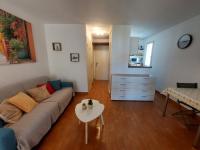 a living room with a couch and a table at Studio Argelès-sur-Mer, 1 pièce, 4 personnes - FR-1-776-63 in Foix