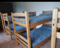 A bed or beds in a room at Albergue Santa Ana