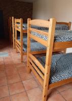A bed or beds in a room at Albergue Santa Ana
