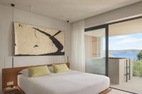 Postel nebo postele na pokoji v ubytování Ilya Botanic Suites