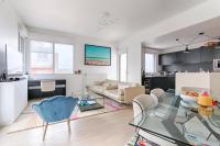 a living room with a glass table and a couch at Resident- Beautiful 6P apartment in Montrouge