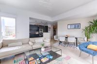 a living room with a couch and a table at Resident- Beautiful 6P apartment in Montrouge