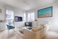 a living room with a couch and a tv at Resident- Beautiful 6P apartment in Montrouge