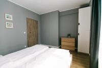 Posteľ alebo postele v izbe v ubytovaní RENTTNER Apartamenty