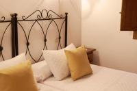 A bed or beds in a room at Casa rural La Aldea
