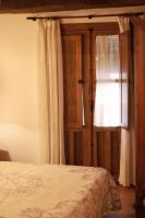 A bed or beds in a room at Casa rural La Aldea