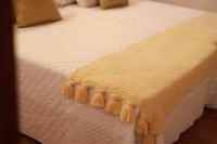 A bed or beds in a room at Casa rural La Aldea