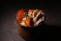a bowl of food sitting on a table at Hotel 1900 Chinatown in Singapore