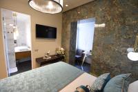 Luxury Rooms Fortunaにあるテレビまたはエンターテインメントセンター
