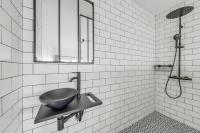 a bathroom with a sink and a shower at 199 Suite Monopoly - Superb Apartment in Paris in Paris