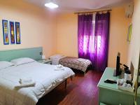 Posteľ alebo postele v izbe v ubytovaní Bosa Guest House
