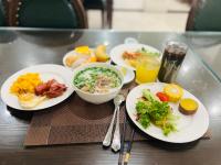 a tray with plates of food on a table at Paragon House and Residence in Hanoi