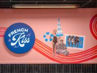 a mural of a woman on the beach with the words french kiss at Eklo Paris Expo Porte de Versailles in Vanves