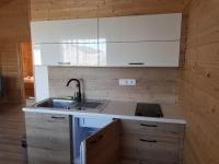 A kitchen or kitchenette at Napsugár Club és Panzió