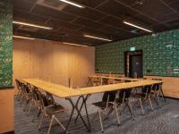 a conference room with a large wooden table and chairs at Eklo Paris Expo Porte de Versailles in Vanves