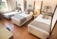 A bed or beds in a room at Alborán Algeciras