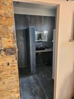 a kitchen with a refrigerator and a sink in it at Chambres d&#39;hôtes Le Montagné in Villeneuve-lès-Avignon