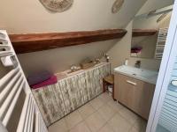 a bathroom with a sink and a bath tub at LES FLORALIES in Froberville