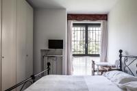 A bed or beds in a room at Bed & Breakfast Cesarina