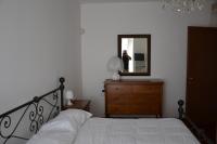 A bed or beds in a room at Bed & Breakfast Cesarina