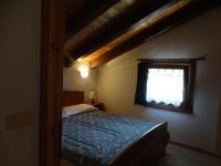A bed or beds in a room at Casevacanza Val d'Ayas