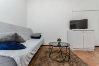 Televízia a/alebo spoločenská miestnosť v ubytovaní Apartments Tabak