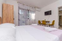 Posteľ alebo postele v izbe v ubytovaní Apartments Tabak