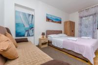 Posteľ alebo postele v izbe v ubytovaní Apartments Tabak