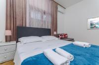 Posteľ alebo postele v izbe v ubytovaní Apartments Tabak